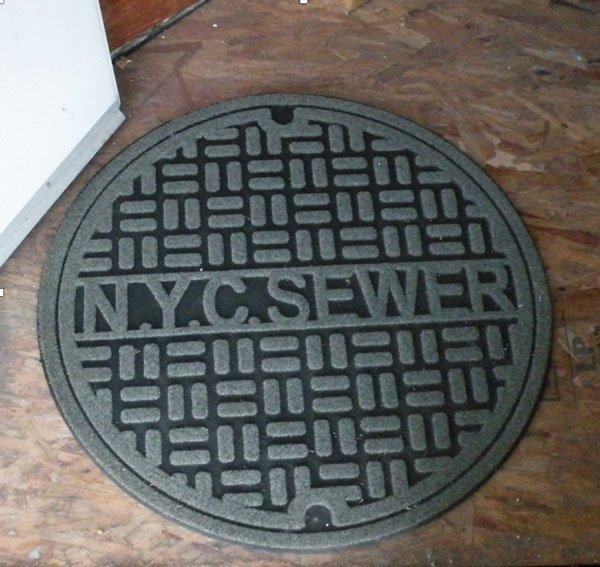 nyc sewer look-alike floor mat