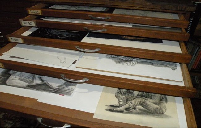 tray cabinet drawers with art stored in them